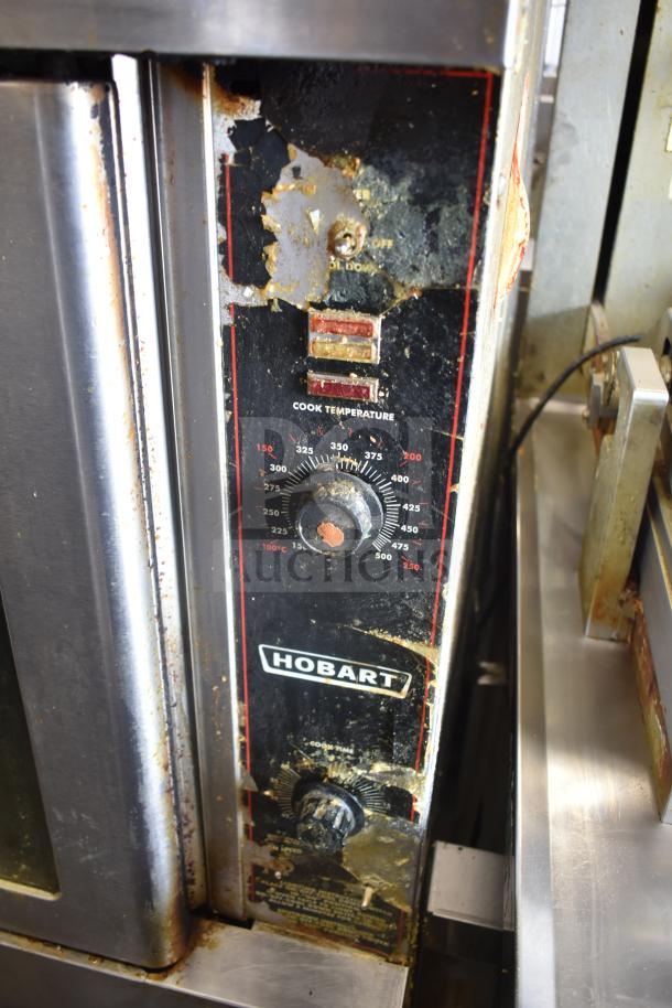 Hobart commercial convection oven, view-through doors, thermostatic controls, metal legs, worn control panel.
