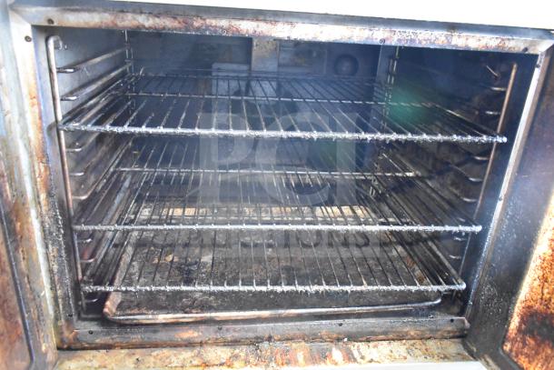 Hobart full-size convection oven with view-through doors, thermostatic controls, metal legs, used condition.