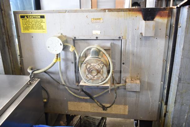 Hobart commercial full-size convection oven back view, showcasing electrical connections. Visible caution labels.