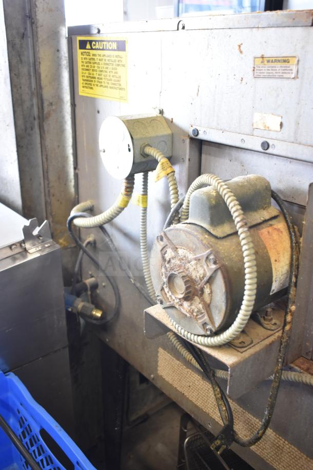 Hobart commercial convection oven, metal legs, view-through doors, thermostatic controls, visible caution labels.
