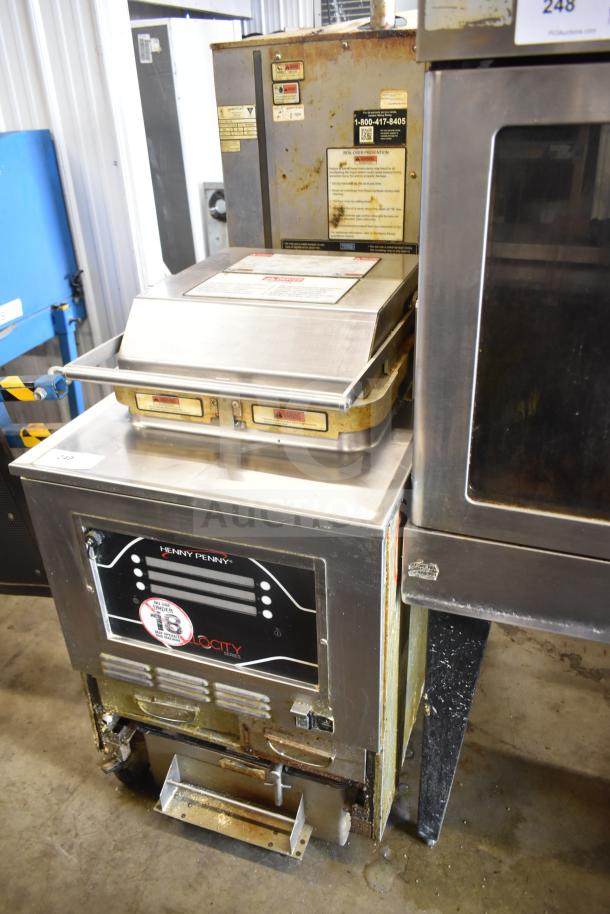 2020 Henny Penny PXE-100 electric pressure fryer on casters, 208V, 3 phase; shows usage wear, label with operating instructions.