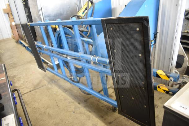 Vac Lift AS Commercial Unit, blue metal frame, suction pads, used condition, suitable for heavy lifting tasks.