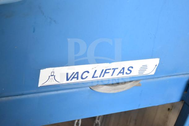Vac Lift AS Commercial Unit, blue metal, labeled "VAC LIFTAS," used condition with visible scratches.