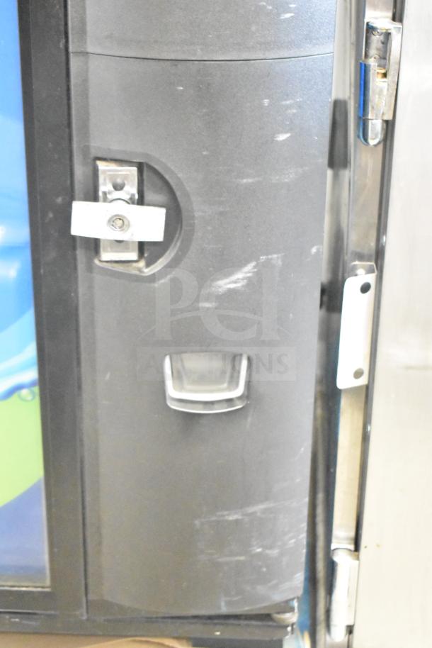 Crane 5800-4 vending machine, shows bill acceptor and lock. Black finish with minor scratches, tested and working.