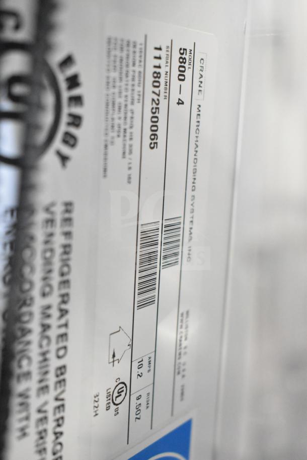 Crane 5800-4 Vending Machine label, showing model, serial number, voltage, and UL certification for auction listing.