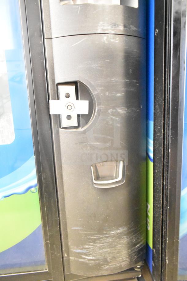 Crane 5800-4 vending machine, black front panel, bill acceptor visible. Model tested and working, 115V, 1 phase.