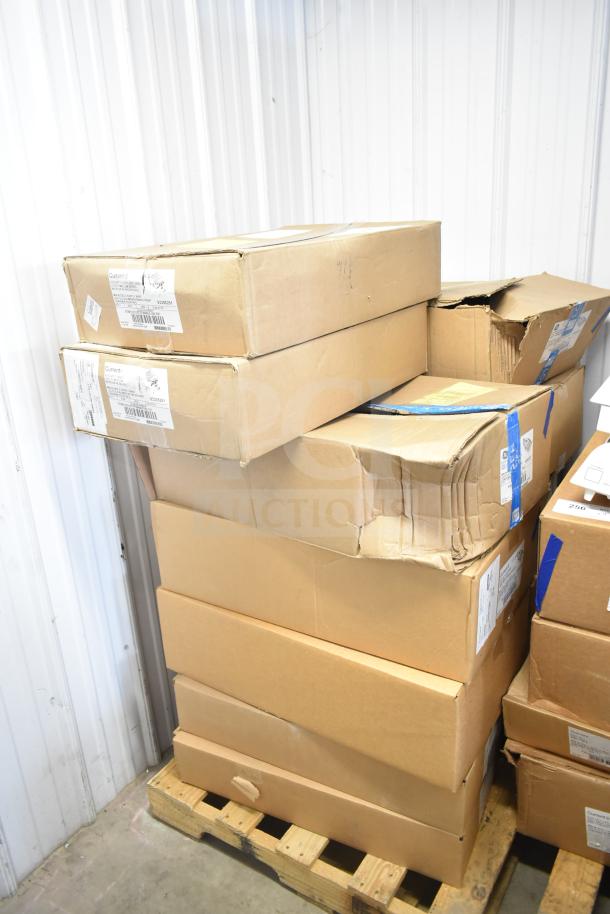 Boxes of Current Evolve LED Flood Lights stacked on a pallet, some with visible labels. Total of 13 in original packaging.