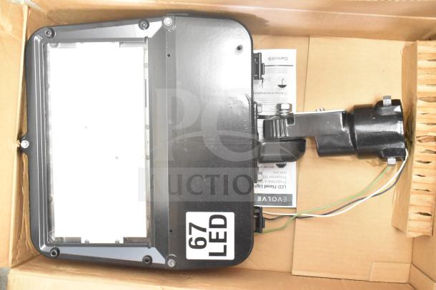 Evolve LED Flood Light in original box, labeled "67 LED." Includes mounting bracket. New condition.