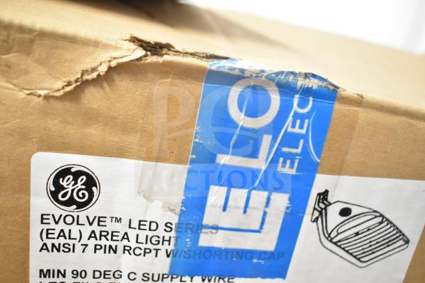 13 GE Evolve LED Series lights in original box, features ANSI 7-pin receptacle. Box shows some wear.