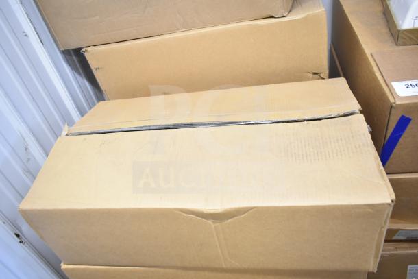 Box containing 13 original Evolve LED flood lights in storage area. Box unopened, indicating new condition.