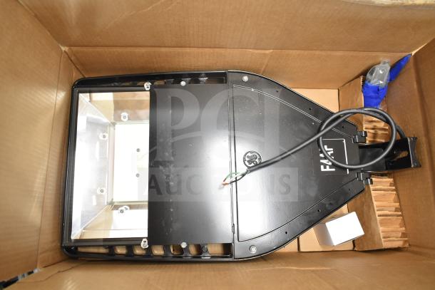 Original box containing a 13-piece set of GE Evolve LED flood lights, with a label indicating model and wiring details.