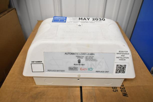 DualLite LED emergency light with automatic load learn feature, operating status indicators, and test button. May 2030 warranty.