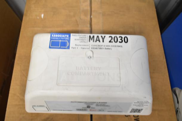 5 DualLite LED Emergency Lights, warranty until May 2030. Features battery compartment, model EVC6E2P-O-WM.