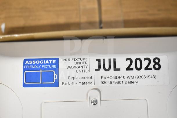 DualLite LED Emergency Light label, warranty until July 2028, model EVHC6IDP-0-WM, includes battery replacement info.