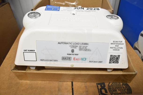 DualLite LED emergency light, featuring "Automatic Load Learn," battery status indicators, and EasyID QR code.