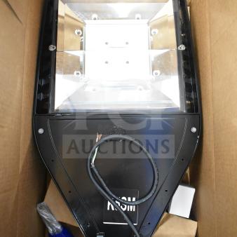 LED flood light in original box, new condition, black finish, GE branding visible. Includes four units.