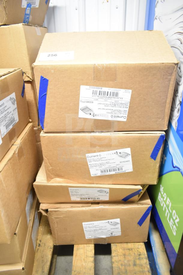 Four boxes of Current Evolve LED Flood Lights in original packaging, labels indicating model and specifications visible.