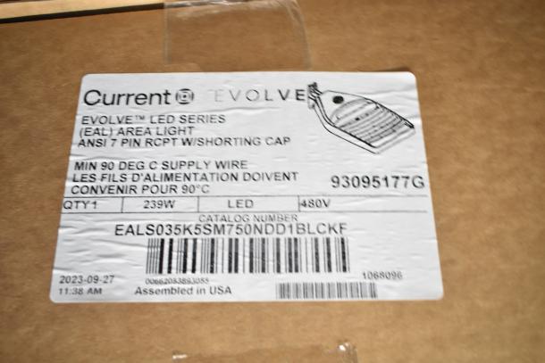 Box with 4 Current Evolve LED Flood Lights, model EALS035K5SM750NDD1BLC, 239W, assembled in USA.
