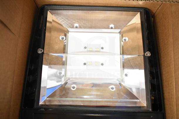 Evolve LED flood light in original box, featuring dual light panels. New condition, potential for 4x bidding value.
