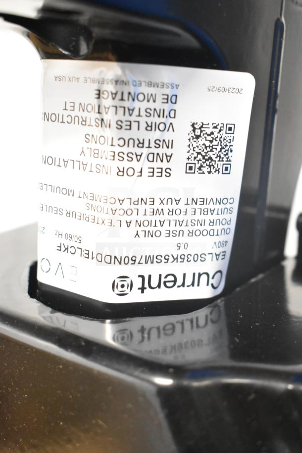 Current Evolve LED Flood Light label showing installation instructions and QR code, model EALS0346WSMV50NDBLCK.