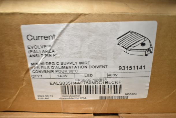 Box with Evolve LED Flood Lights, 140W, 480V, labeled with catalog number EALS035H4AF750NDC1BLCKF. Made in USA.