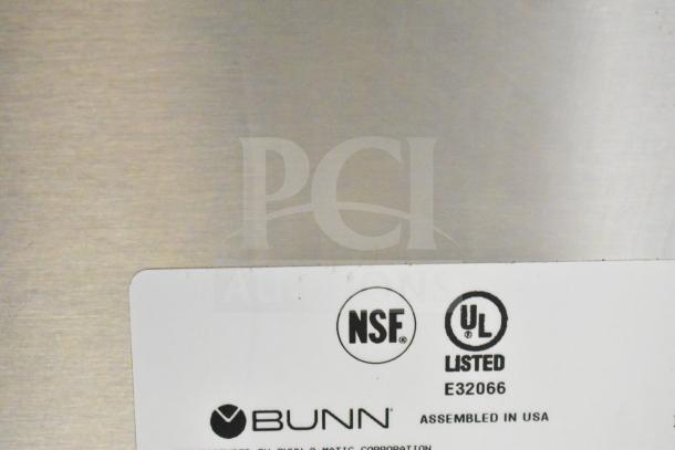 Bunn AXIOM TWIN APS double coffee machine label showing NSF and UL listings, model details, assembled in the USA.