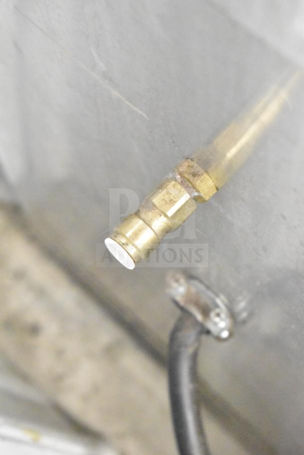 Close-up of a brass fitting on a 2016 Bunn AXIOM TWIN APS Commercial Coffee Machine. Features durable metal construction.