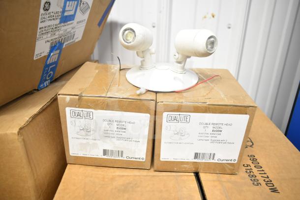 16 items including DualLite LED emergency light with battery backup, dual remote heads, and exit signs. Boxes labeled for wet location use.