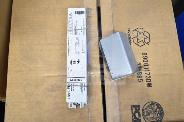 16 items including LED emergency lights, DualLite exit signs, and remote heads. New condition, labeled "eldoLED."