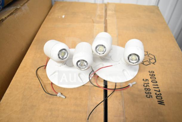 16 items including LED emergency light battery backup, DualLite double remote heads, and DualLite exit signs on a cardboard box.