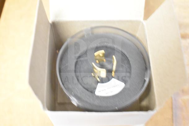 Box containing LED emergency light battery backup. Features mounting components and label indicating model details.