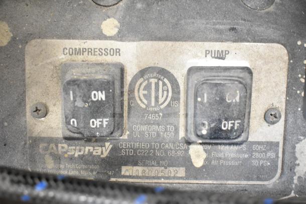 CapSpray Compressor/Pump controls showing Intertek certification, on/off switches, and model specifications etched on the panel.