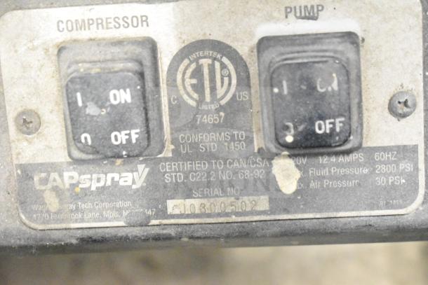 CapSpray Compressor/Pump with switches for compressor and pump, certification labels, and serial number J0800502.