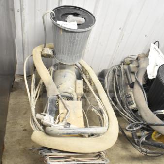 SprayTech 1075 Airless Spraying System, used condition, with attached hoses and cables, auction tag visible on top.