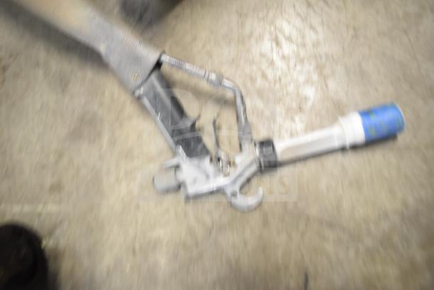 SprayTech 1075 Airless Spraying System, used, features metal spray gun and hose. Some wear visible on parts.
