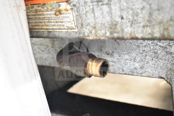 Pitco Frialator SG14 fryer gas connection detail, showing rusty metal structure. Natural gas powered, 110,000 BTU.