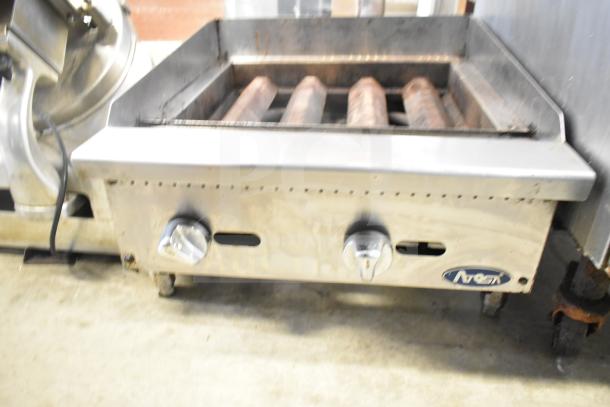 Atosa commercial countertop gas charbroiler grill missing grates; control knobs visible; stainless steel construction; model branding shown.