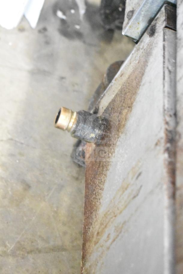 Atosa Commercial Countertop Gas Charbroiler Grill, missing grates, visible wear, rust near corner, gas connection detail.