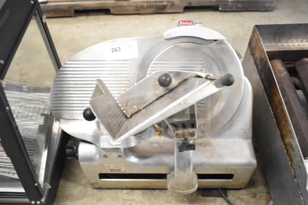 Berkel 818 commercial meat slicer with blade sharpener, 115V, 1-phase. Used condition, serial tag visible.
