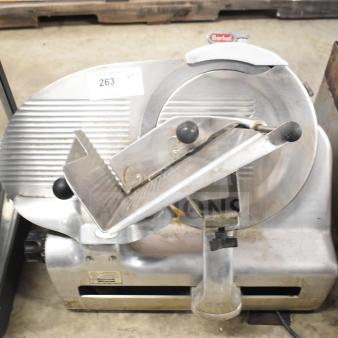 Berkel 818 commercial meat slicer with blade sharpener, 115V, 1-phase. Used condition, serial tag visible.