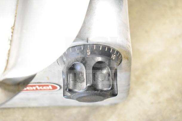 Berkel 818 commercial meat slicer with blade sharpener, adjustable dial, visible logo, 115V, 1 phase.