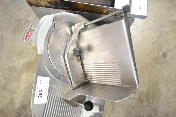 Berkel 818 Commercial Meat Slicer with blade sharpener; 115V, 1 phase; stainless steel; visible Berkel logo and auction tag.
