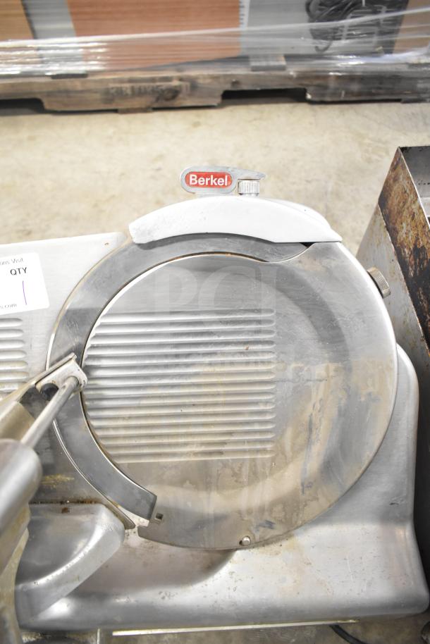Berkel 818 Commercial Automatic Meat Slicer with Blade Sharpener, 115 Volts, 1 Phase. Visible wear, brand logo on top.