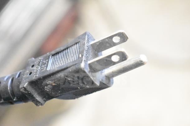 Close-up of a two-prong plug for the 2022 Commercial Countertop Food Warmer Display Merchandiser, 110 Volts, 1 Phase.