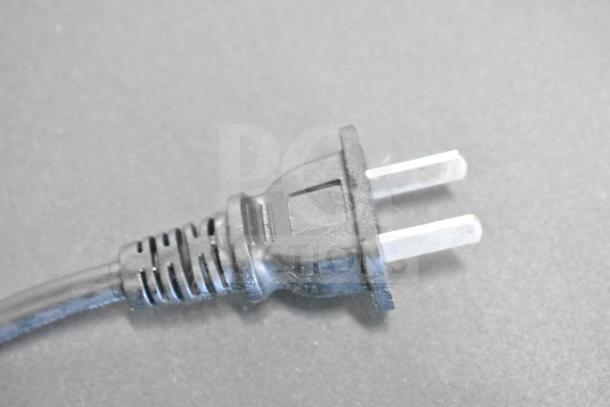 Close-up of a commercial countertop food warmer's power plug. 110 volts, 1-phase compatible. New condition, 2022 model.