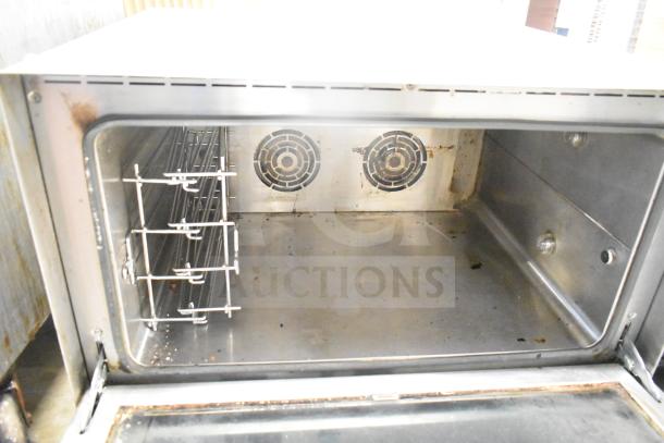 Vollrath Cayenne COA 8005 40702 countertop electric convection oven, 230V, 1 phase; interior view showing shelves and fans, fair condition.