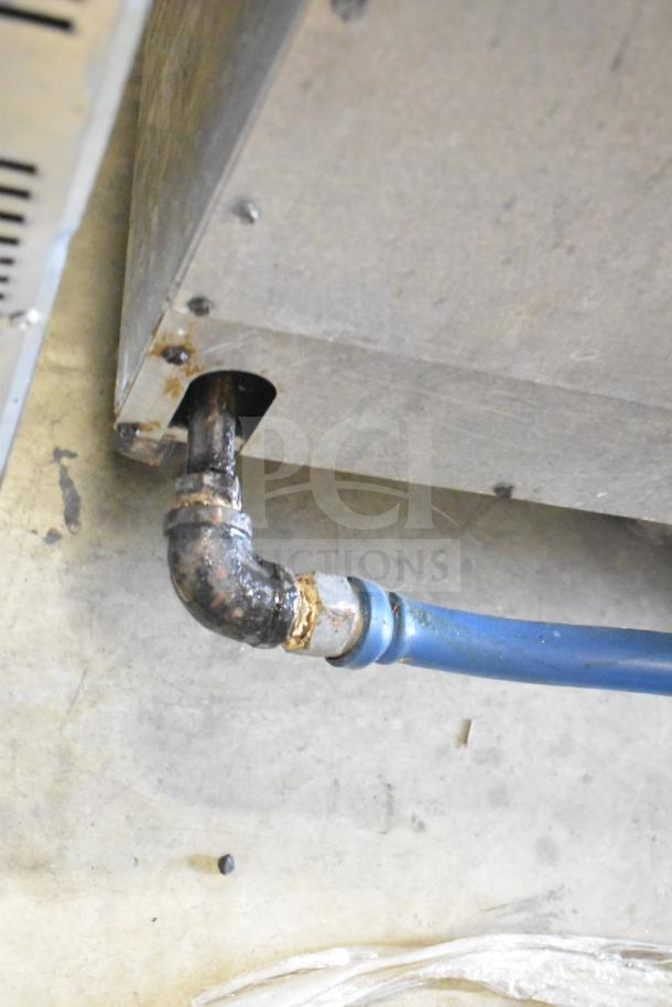 Dean SR42GNS commercial gas deep fat fryer underside view, showing connection and wear. 105,000 BTU.