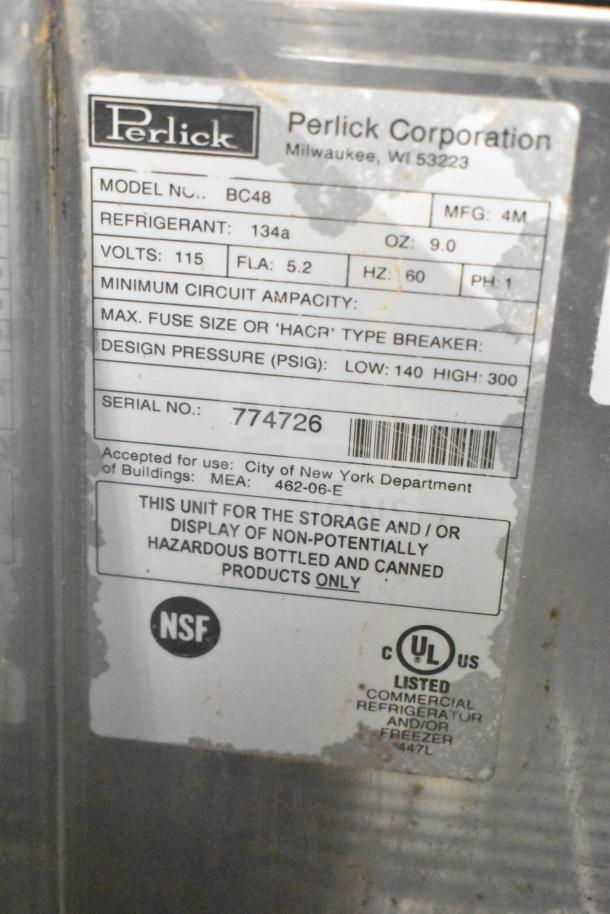 Perlick BC48 commercial back bar bottle cooler, 115 volts, with 2 sliding lids. Model info and certification labels visible.