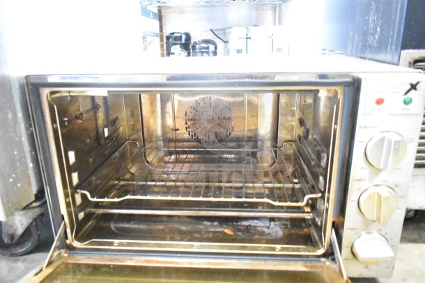 Waring WCO500X Half Size Convection Oven, 120V, 1 Phase. Features dials for function, temperature, timer. Used condition.