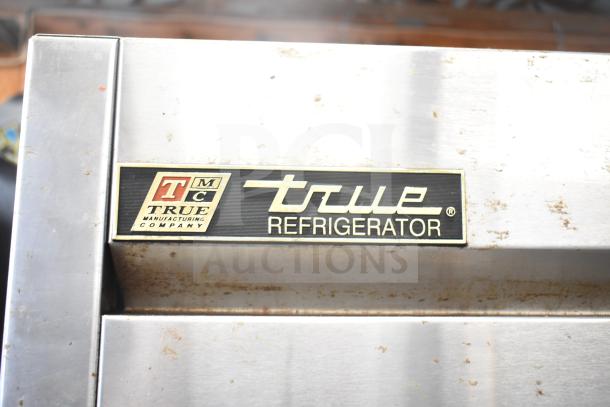 True T-23 Commercial Single Door Reach In Cooler, True brand label visible, stainless steel, 115 Volts, 1 Phase.